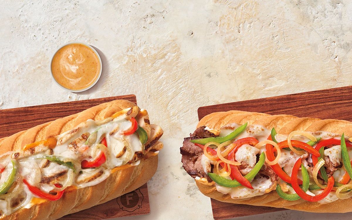 Firehouse Subs deli sub with provolone, lettuce, tomato and onion